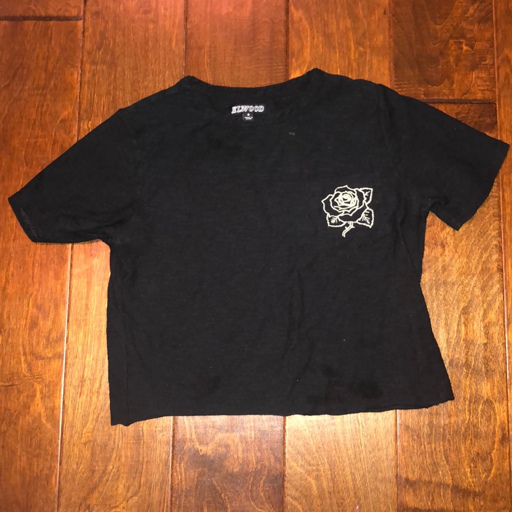 black t-shirt with a rose on it